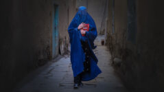 Afghan Woman with a book in hand