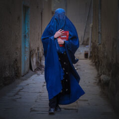 Afghan Woman with a book in hand